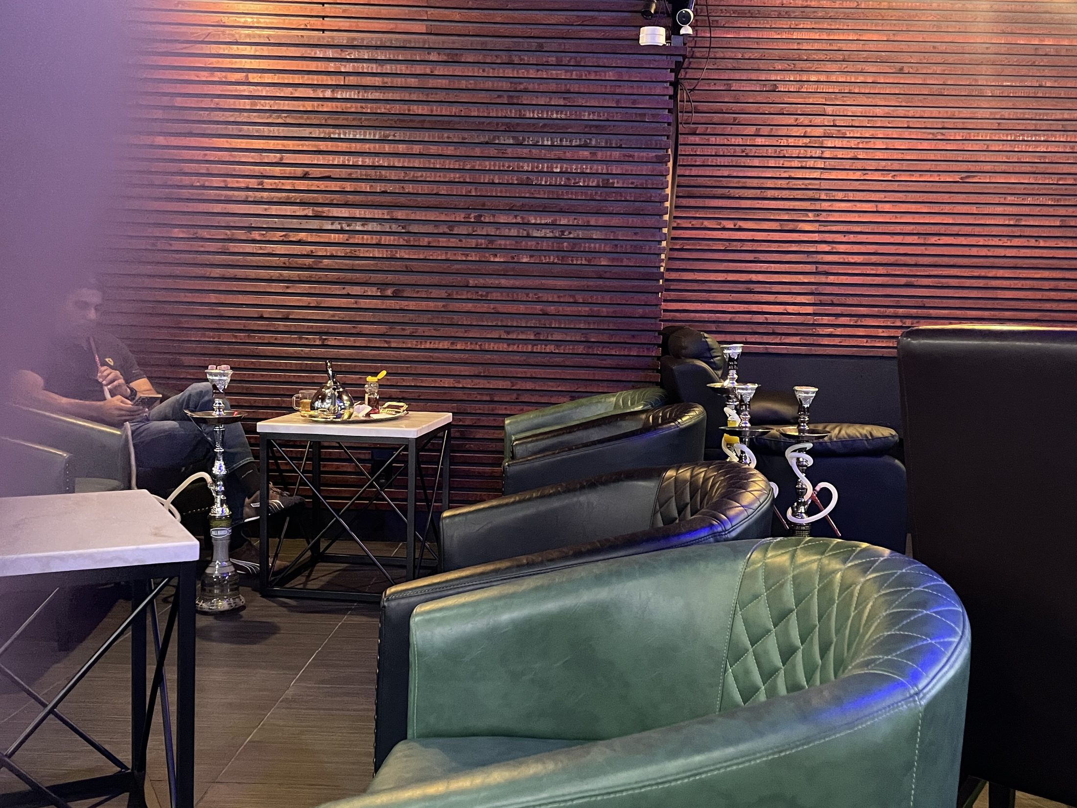 Seating and hookahs inside Shi Chai Hookah Lounge
